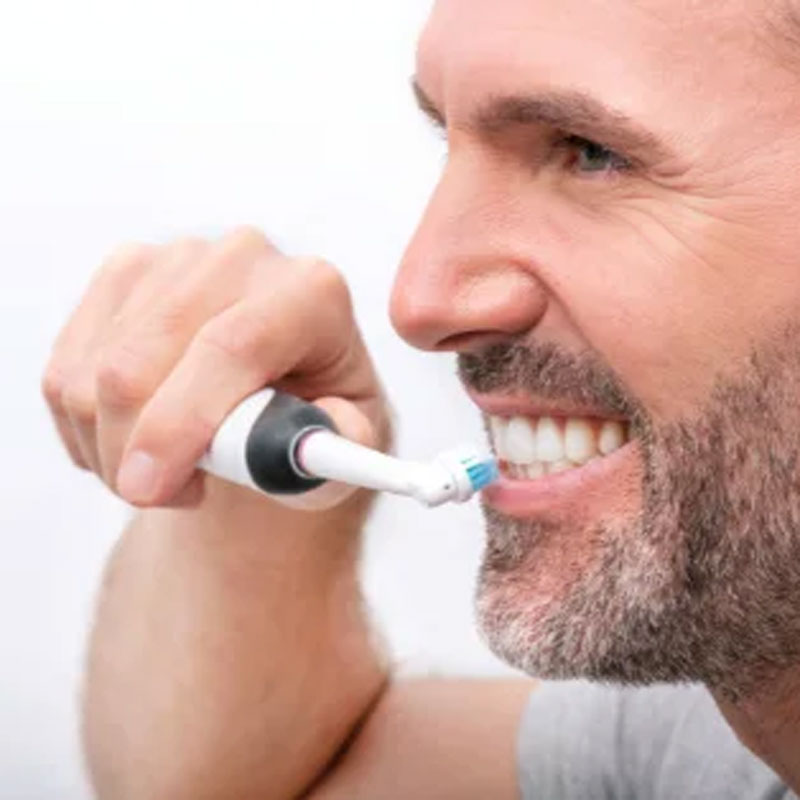 man brushing teeth